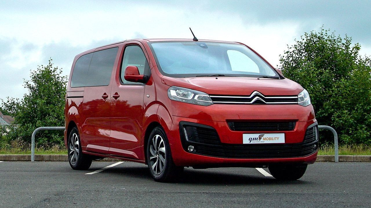 Red Citroën Spacetourer with a GM Mobility number plate, parked in a car park.